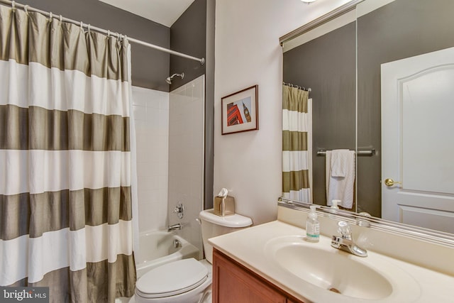 full bathroom featuring vanity, toilet, and shower / tub combo with curtain