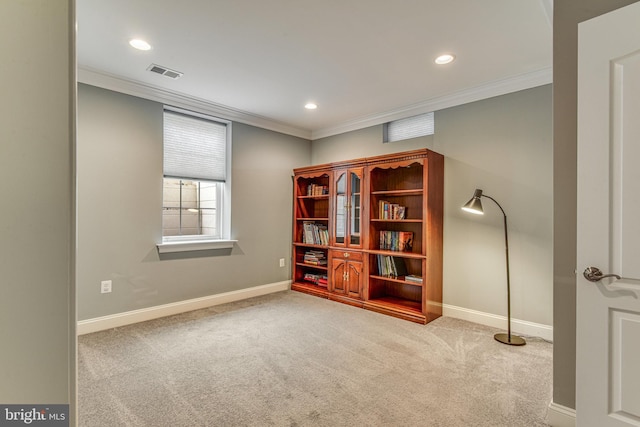 interior space with visible vents, baseboards, carpet, and ornamental molding