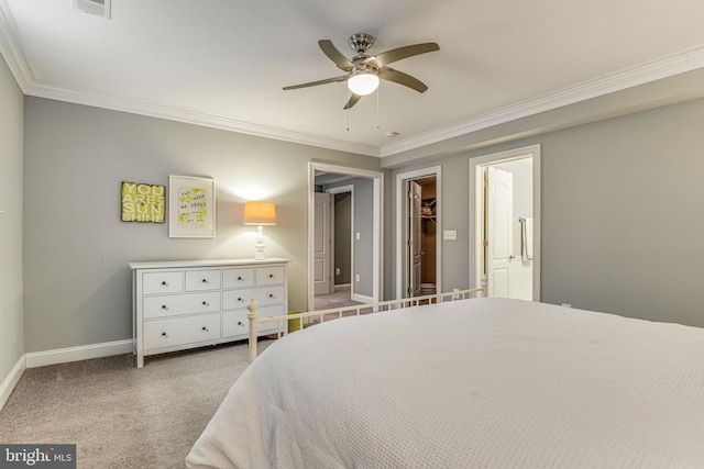 bedroom with ceiling fan, crown molding, baseboards, and carpet floors