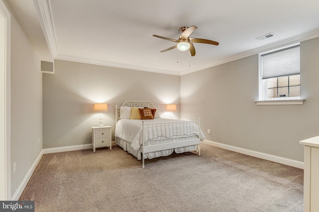 bedroom with crown molding, carpet flooring, baseboards, and visible vents