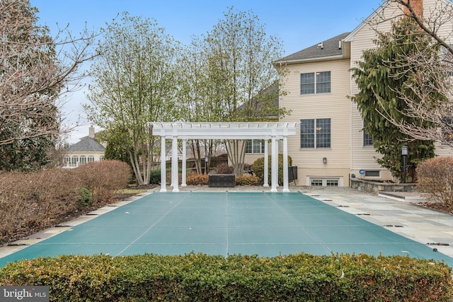 view of pool with a covered pool, a patio, and a pergola