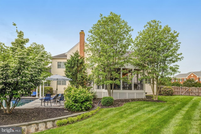 view of yard featuring a patio and fence