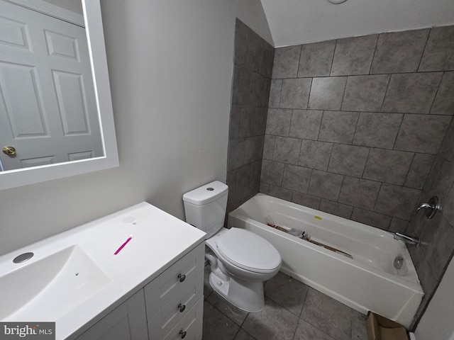 bathroom with tile patterned flooring, bathtub / shower combination, vanity, and toilet