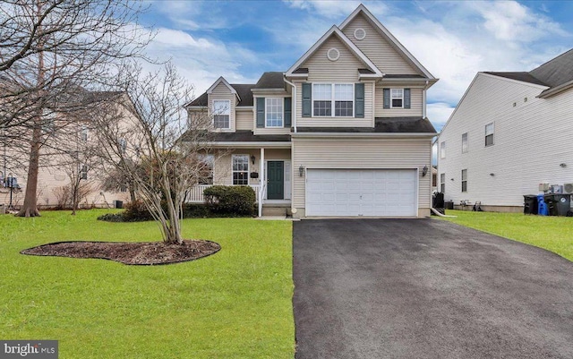 view of front facade with driveway, a front lawn, and a garage