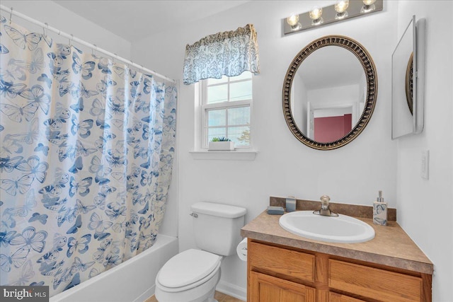 full bath featuring vanity, toilet, and shower / bath combo