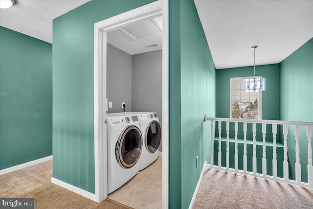 laundry area with visible vents, baseboards, laundry area, a notable chandelier, and separate washer and dryer