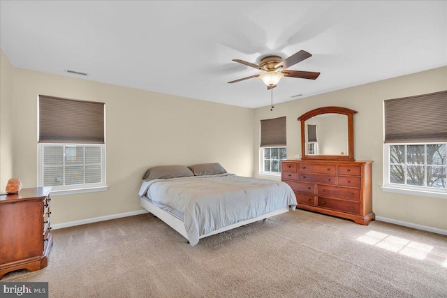 bedroom with carpet, visible vents, and baseboards