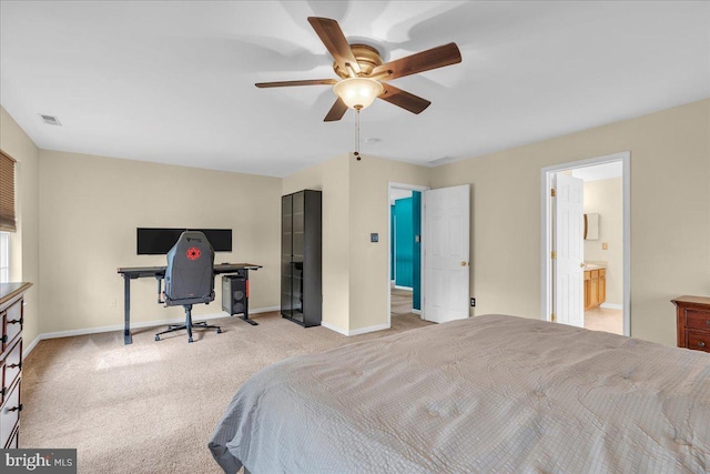 bedroom with connected bathroom, carpet, visible vents, and baseboards