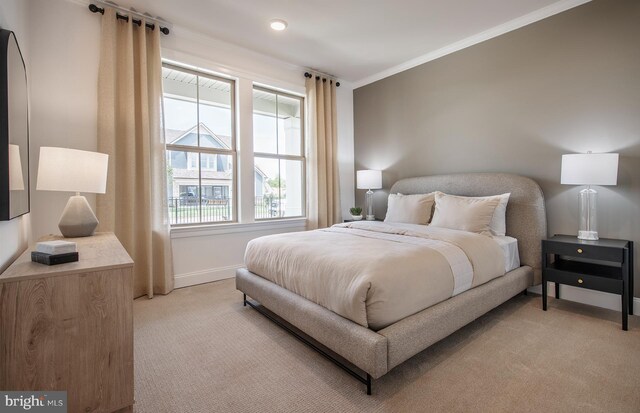 bedroom with ornamental molding, light carpet, and baseboards