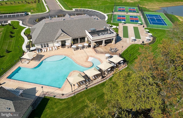 community pool with a patio