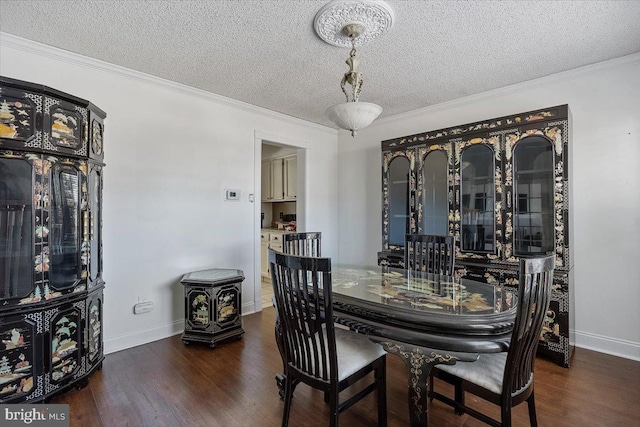 dining area featuring wood finished floors and crown molding