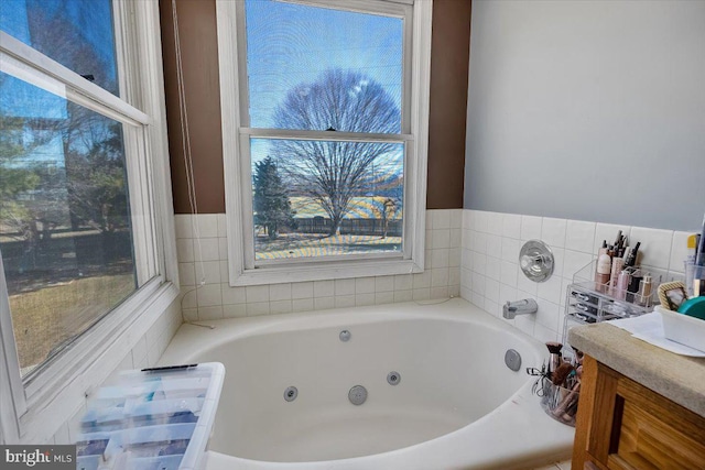 bathroom with a tub with jets