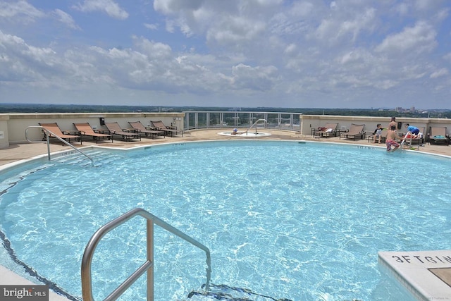 pool featuring a patio area