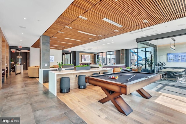 rec room with wooden ceiling, pool table, and light wood finished floors