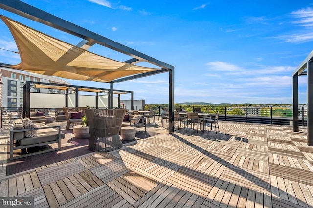 wooden deck with an outdoor living space, outdoor dining space, and a pergola