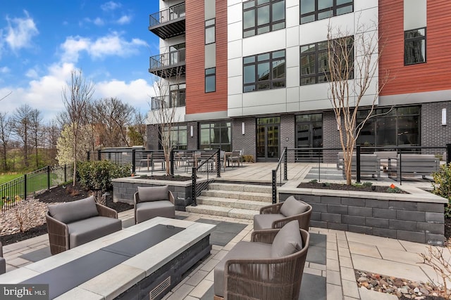 view of patio / terrace featuring an outdoor hangout area and fence