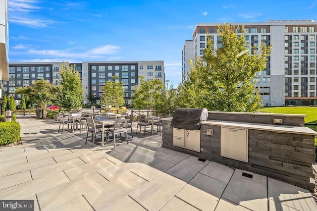 view of patio featuring a grill and an outdoor kitchen