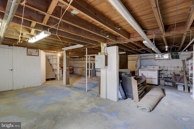 below grade area with washer and dryer and stairway