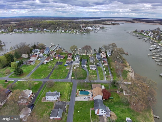 bird's eye view with a water view and a residential view