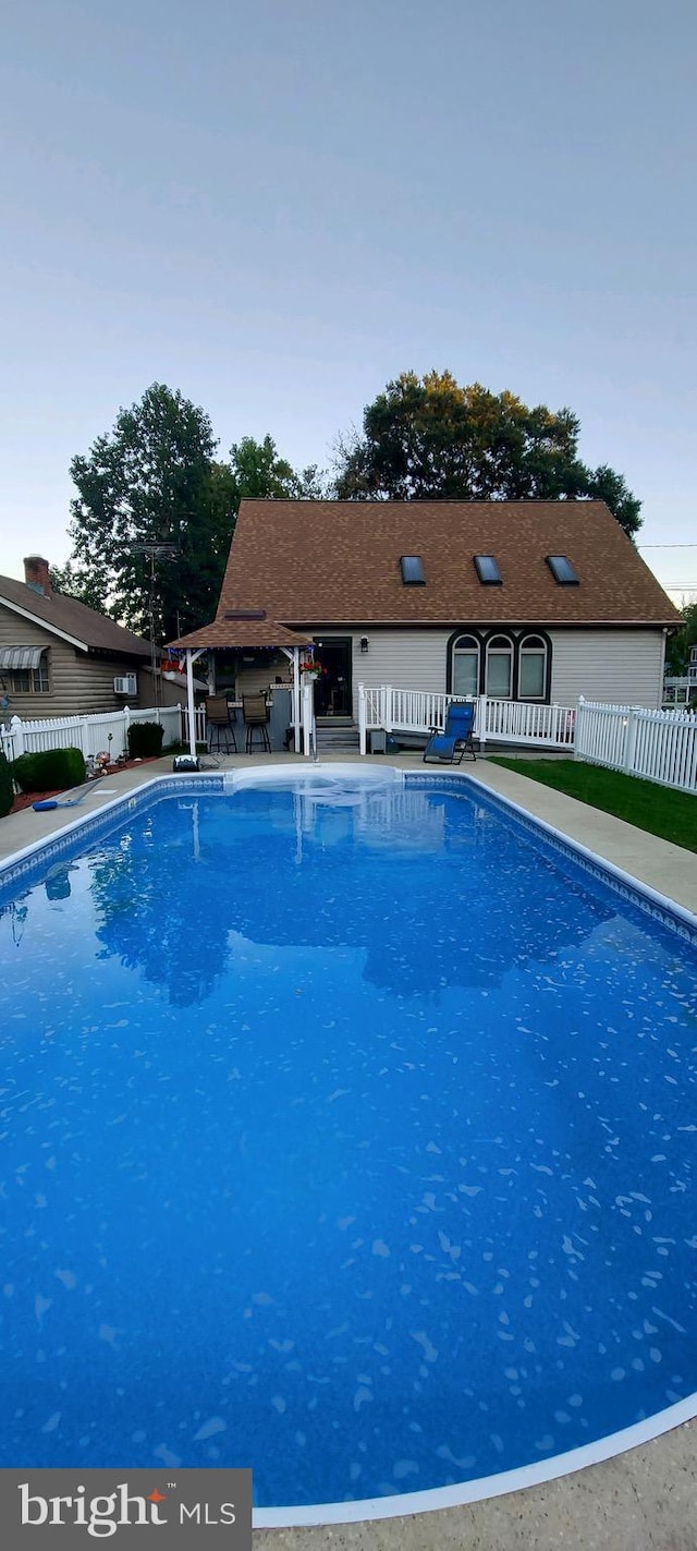 view of swimming pool featuring fence and a fenced in pool