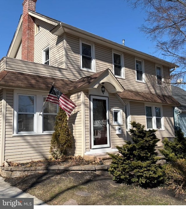 view of front of home with a chimney