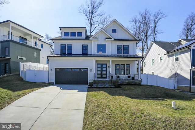 modern inspired farmhouse featuring fence, board and batten siding, and a standing seam roof