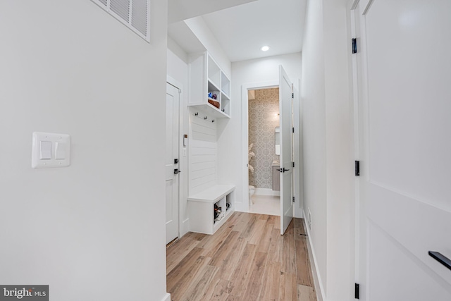 mudroom featuring recessed lighting, visible vents, baseboards, and light wood-style flooring