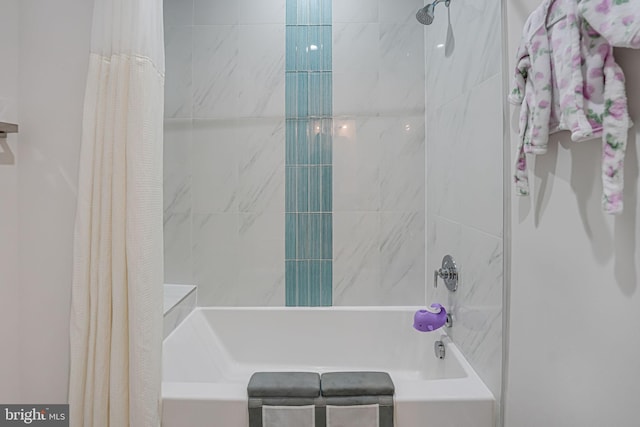 bathroom featuring shower / bathtub combination with curtain