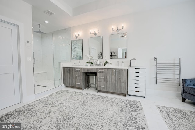 bathroom with visible vents, baseboards, double vanity, a stall shower, and marble finish floor