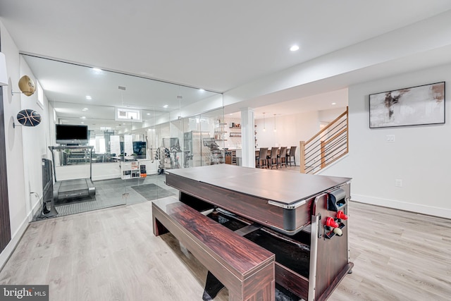 dining room featuring recessed lighting, light wood-type flooring, baseboards, and stairway