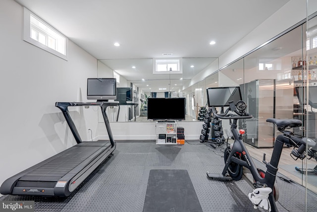 exercise area featuring recessed lighting