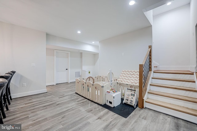 interior space featuring visible vents, recessed lighting, baseboards, and wood finished floors