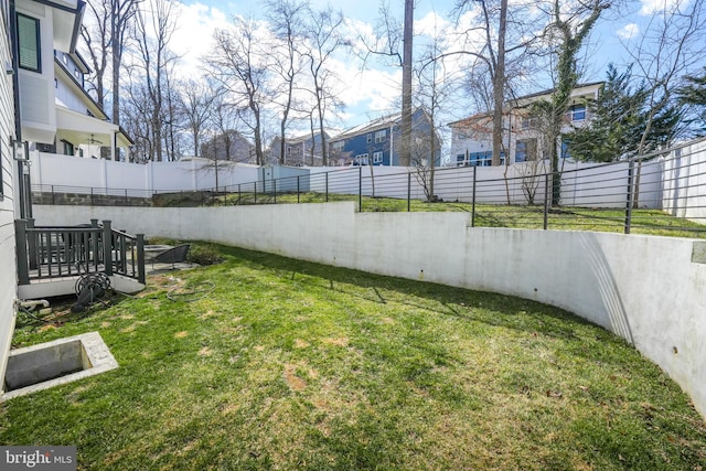 view of yard with a fenced backyard