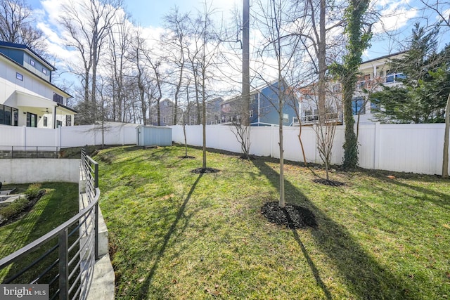 view of yard with a fenced backyard