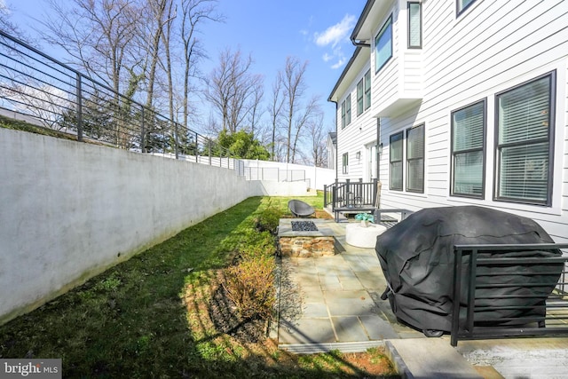 view of patio / terrace with area for grilling and a fenced backyard