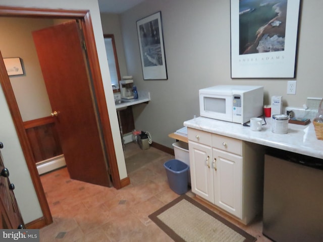 bathroom featuring a baseboard radiator and baseboards