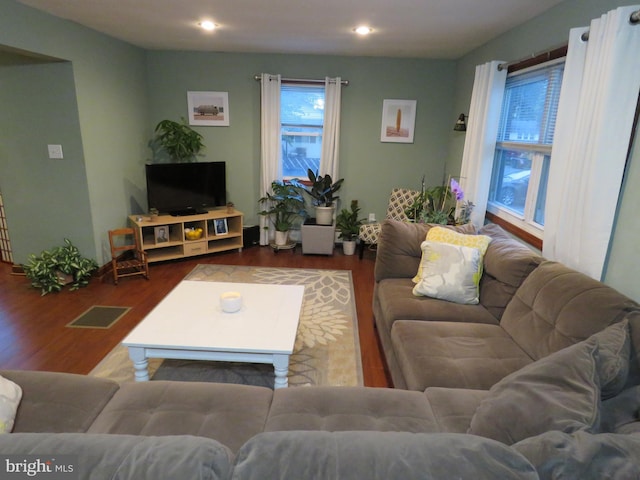 living room featuring wood finished floors and recessed lighting