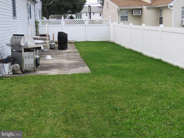 view of yard featuring a patio and a fenced backyard