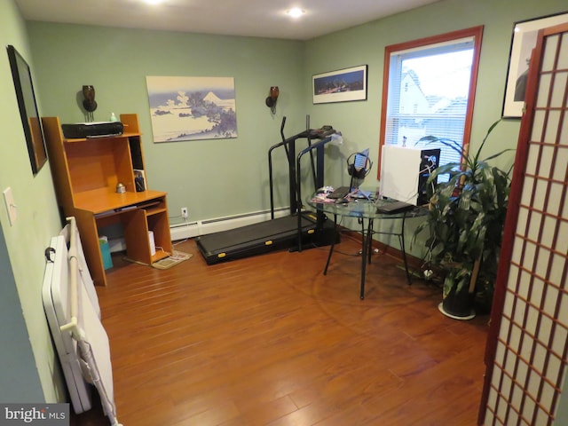 interior space featuring a baseboard radiator and wood finished floors