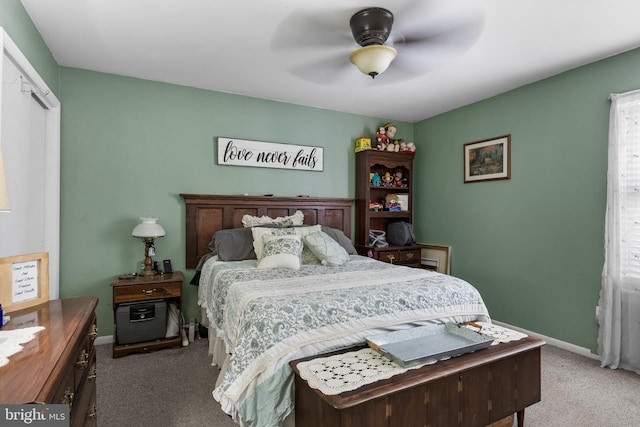 bedroom with carpet, ceiling fan, and baseboards