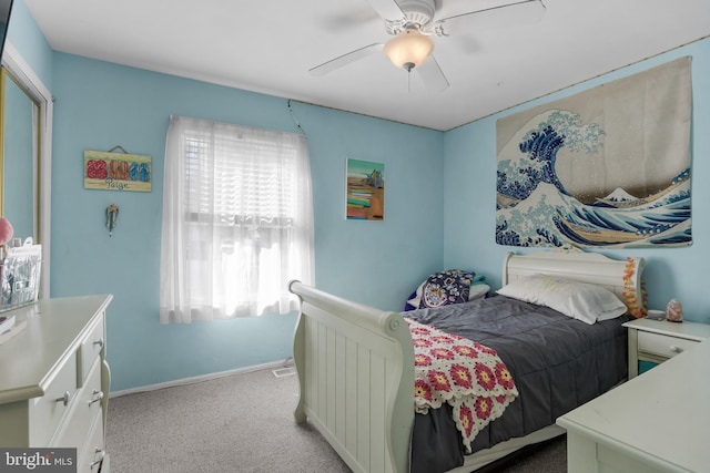 bedroom with carpet, baseboards, and a ceiling fan