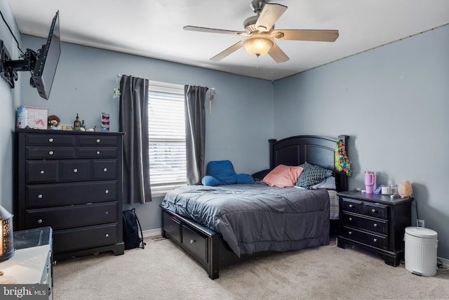 bedroom with light carpet and ceiling fan