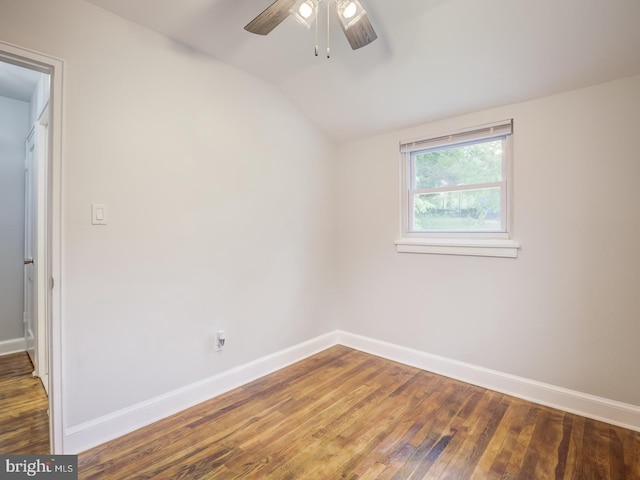 unfurnished room with ceiling fan, lofted ceiling, baseboards, and hardwood / wood-style floors