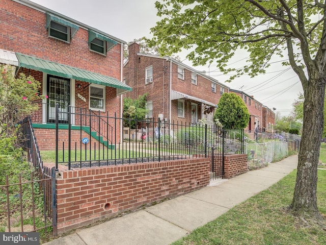 exterior space with a yard and a fenced front yard