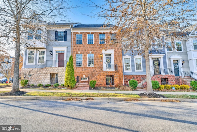 multi unit property featuring brick siding