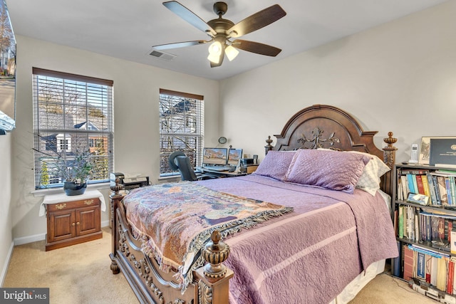 bedroom with baseboards, ceiling fan, visible vents, and light colored carpet