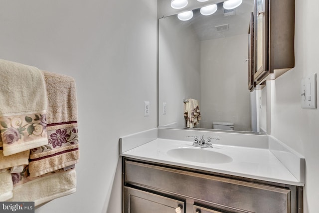 bathroom with toilet and vanity