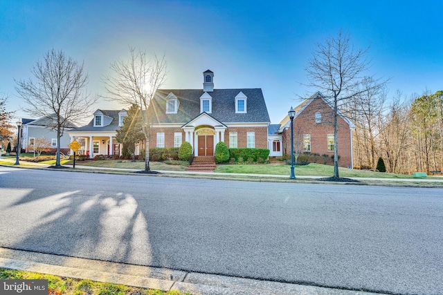 view of front of property featuring brick siding