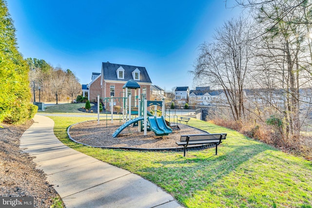 community jungle gym with a yard