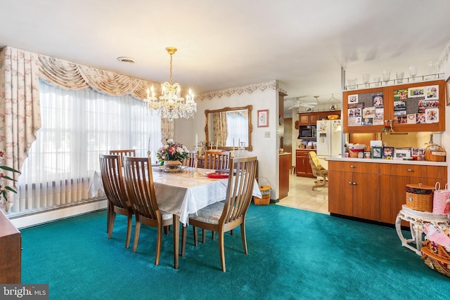 dining area featuring visible vents, a baseboard heating unit, a chandelier, light carpet, and light tile patterned floors